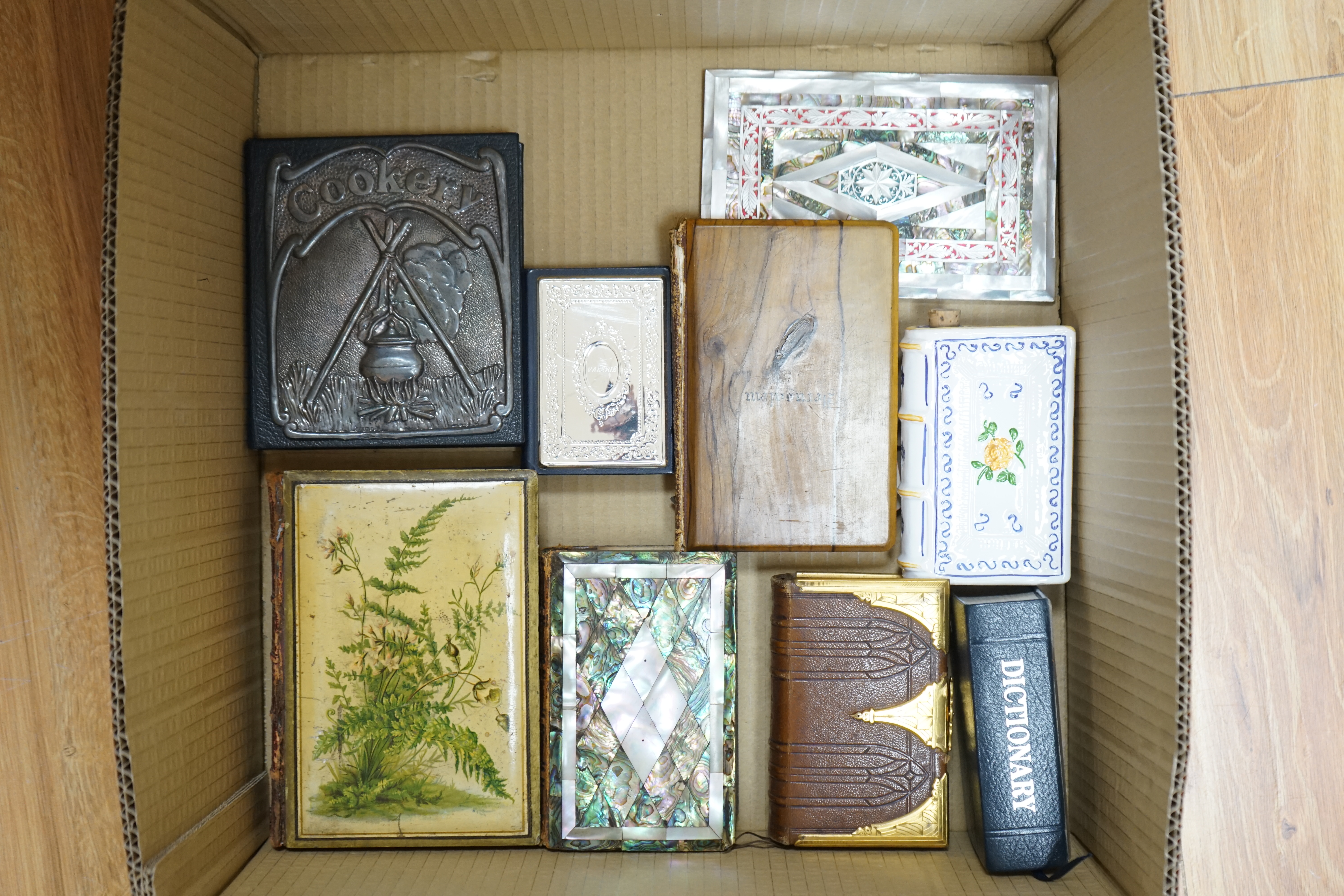 A small group of other assorted novelty bindings, including mother of pearl, leather and silver plate. Condition - varies